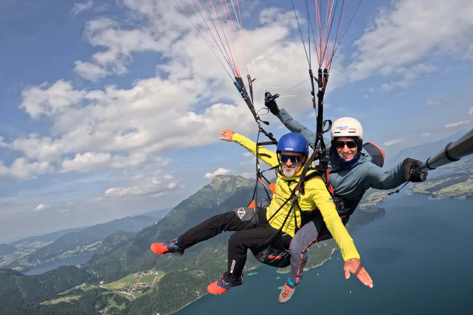 Tandem flight Wolfgangsee - passenger and pilot paragliding over the Salzkammergut